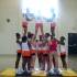 St.James High School Cheerleaders- ball back, to superman pyramid.